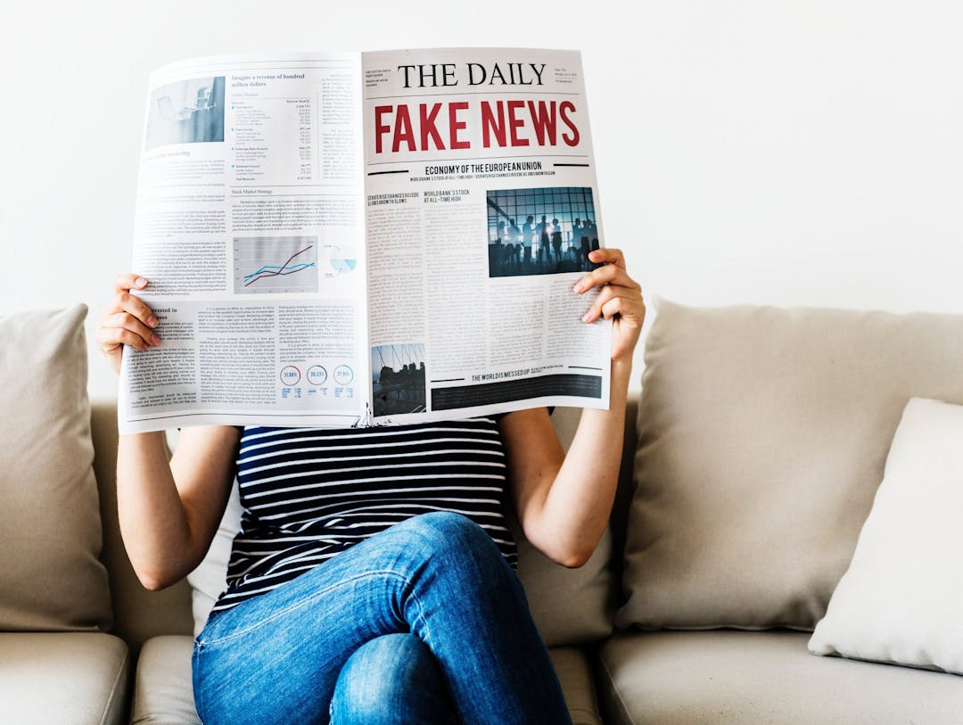 a person holding a newspaper