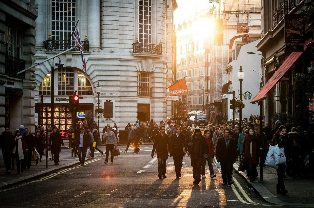 urban sunset with people walking