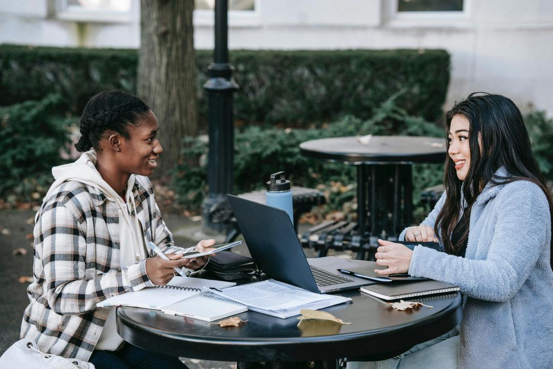 two females talking at the park