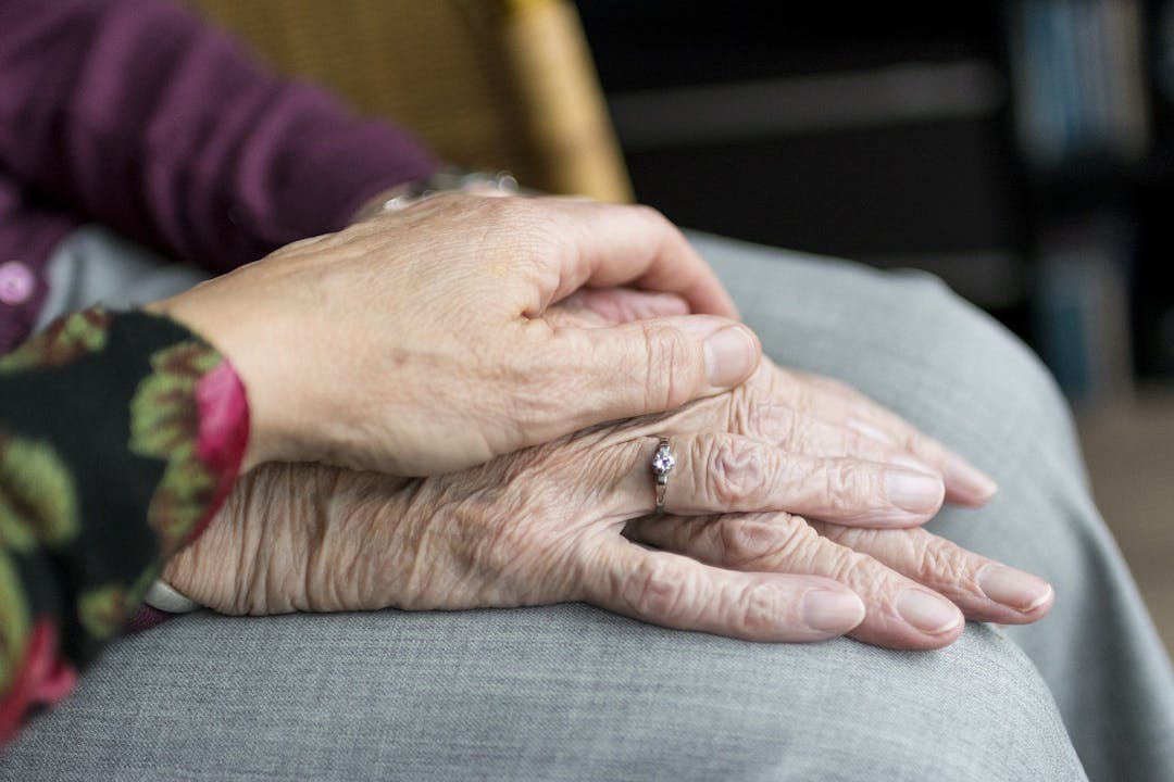 hands of old couple