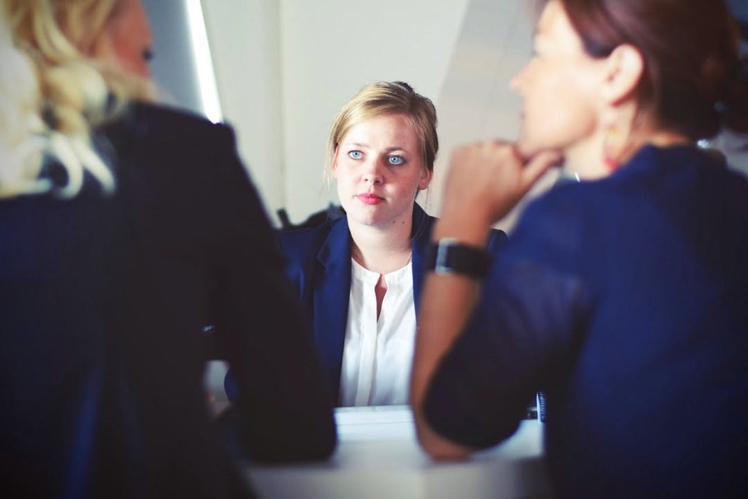 woman looking at another woman