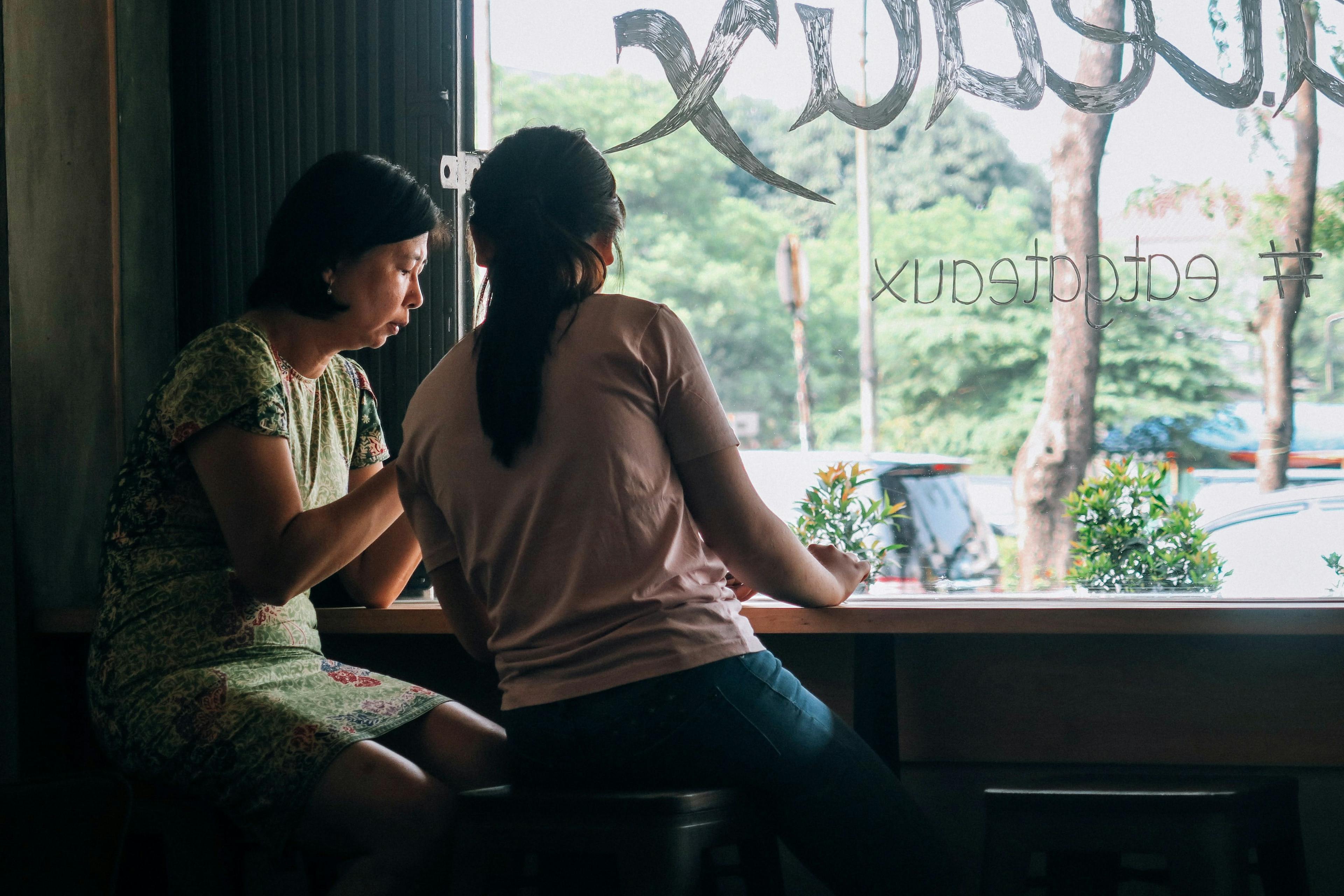 two women by the window in a store