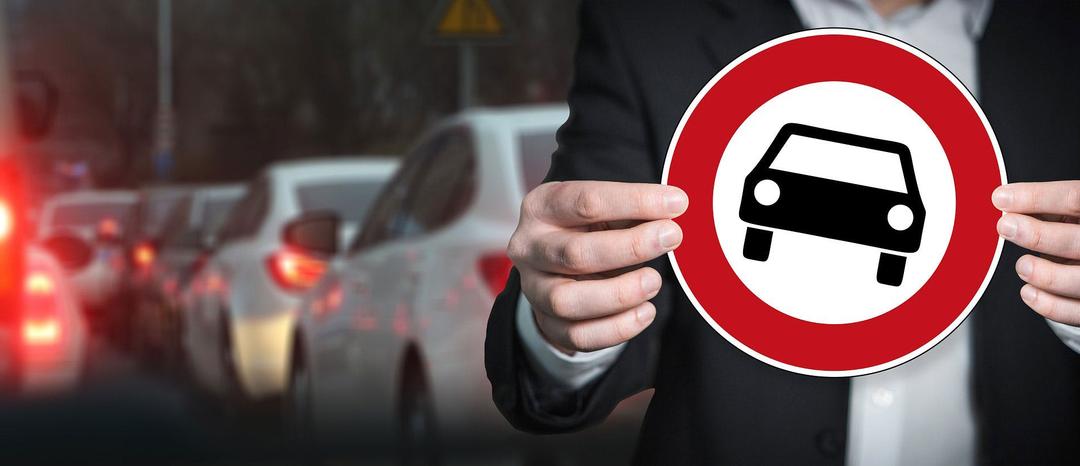 Person holding a sign of a car