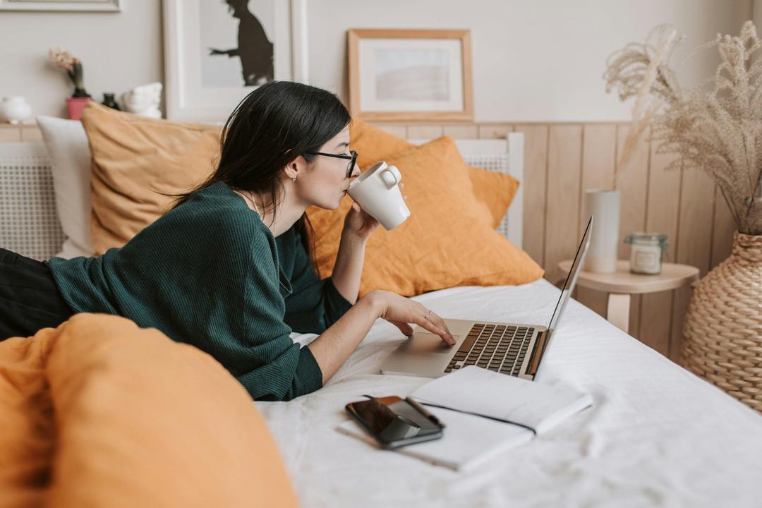 woman using laptop online