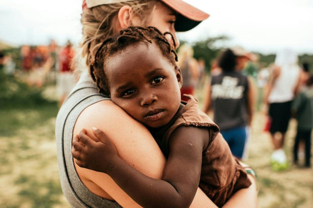 Woman hugging child